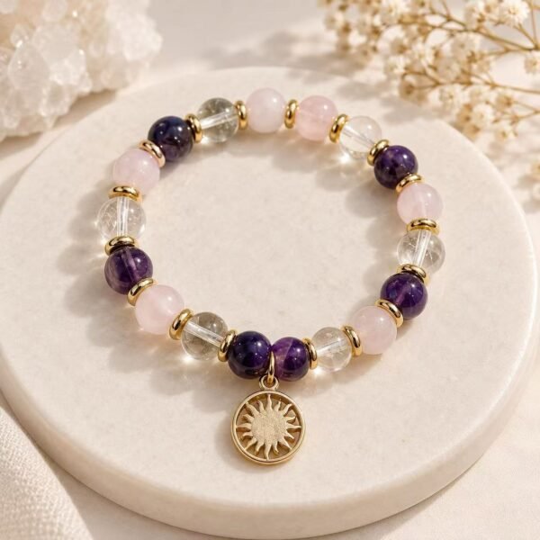 Dream Intuition natural crystal bracelet with amethyst, rose quartz, clear quartz and gold sun charm