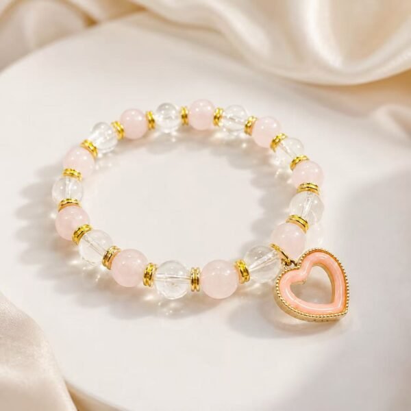 Kind Heart Rose Quartz and Clear Quartz bracelet with gold spacers and pink heart charm