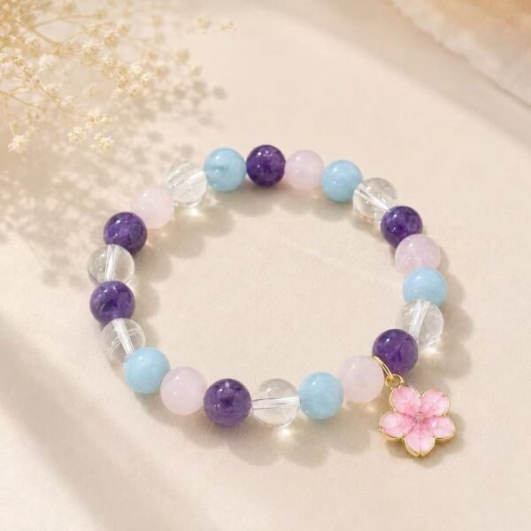 Violet Wisdom natural crystal bracelet with purple, blue, pink and clear beads and pink flower charm